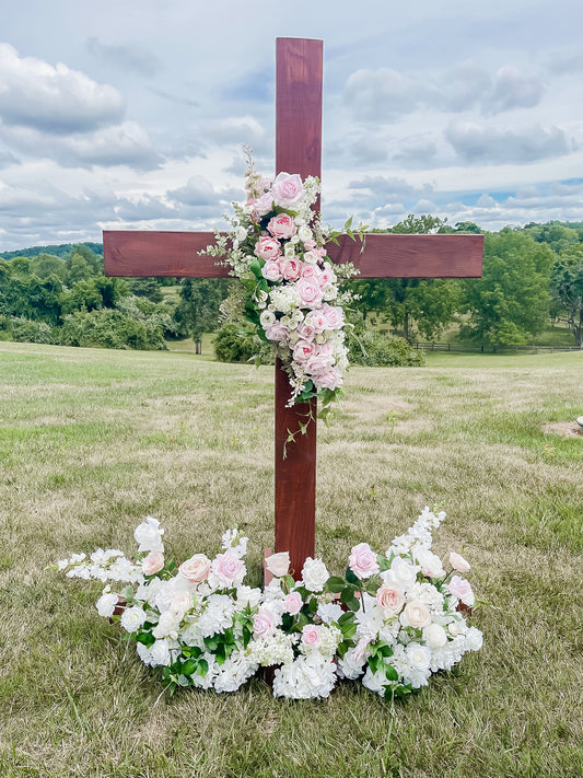 Large Wooden Cross Embellished with a Floral Garland.